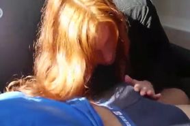 Natural redhead gives a blowjob after workout session