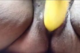 Ebony teen uses banana as a dildo and squirt everywhere