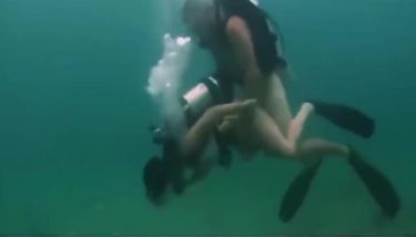 Nude couples scuba diving