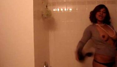 Hot girl strips and dances under shower