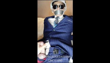 Korean model slave in navy stripe suit, bound and tape gagged, cum ...